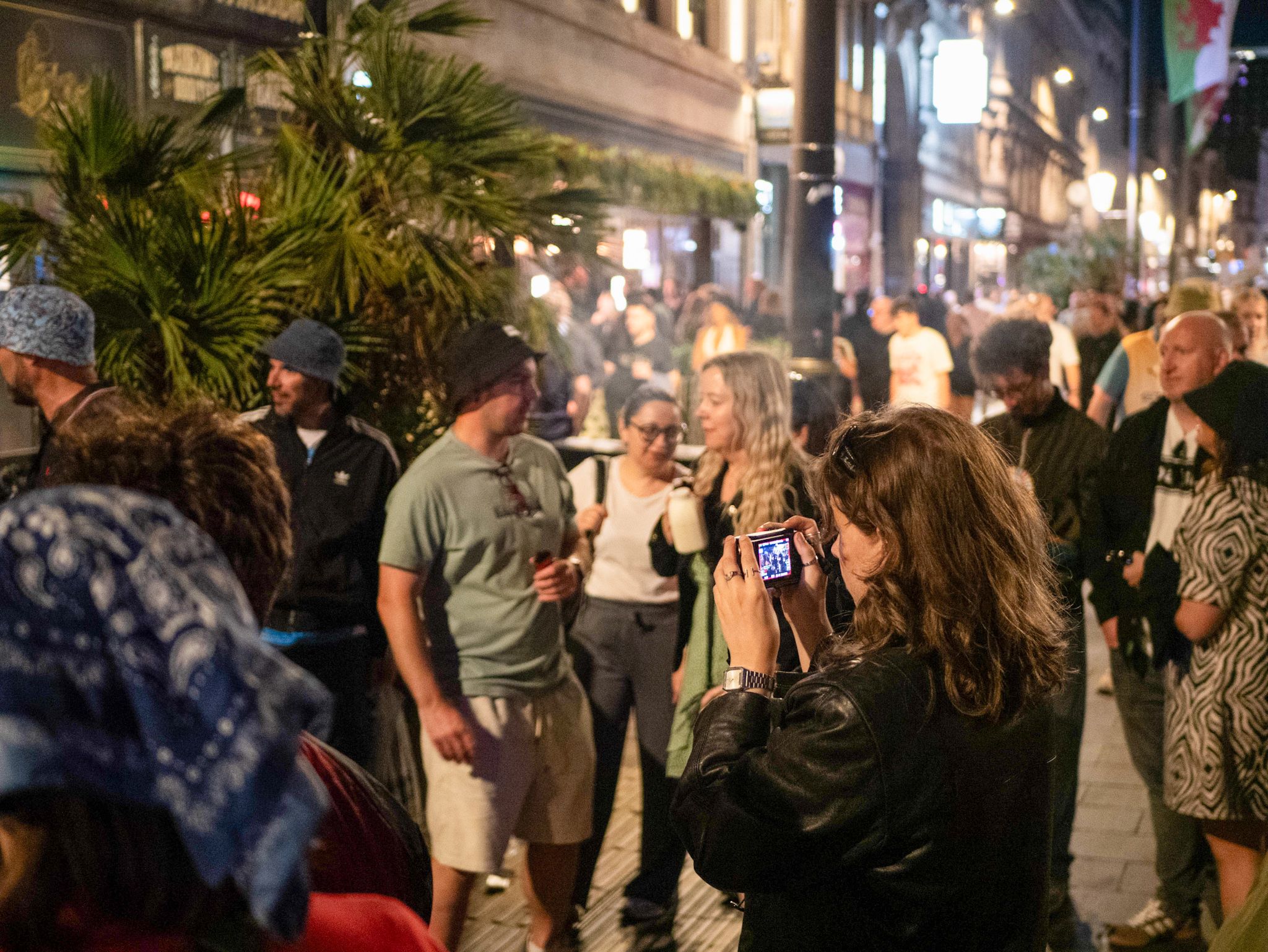 Me filming the crowd of Oasis fans on St Marys street with a camera after the gig