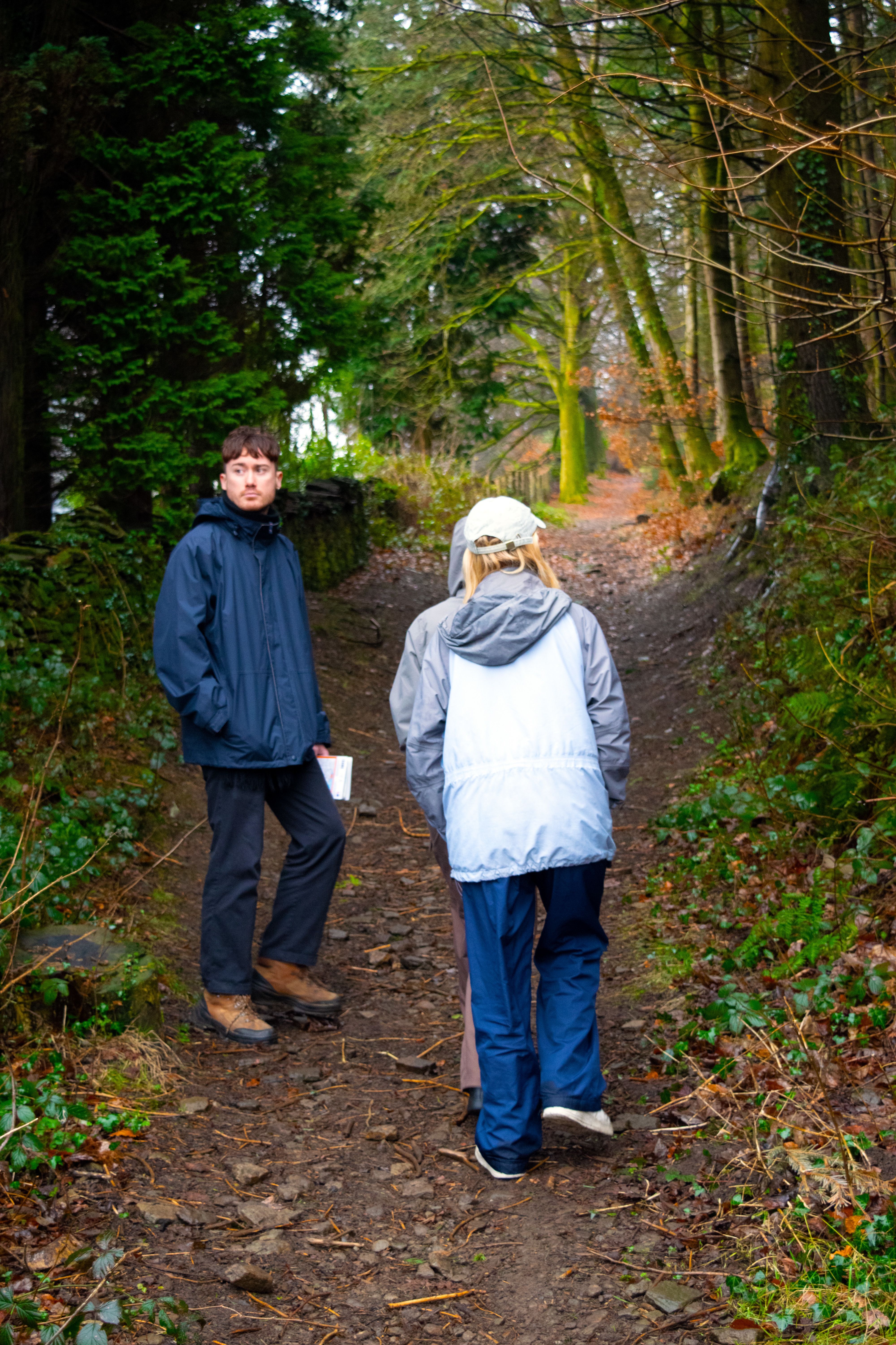 Matt, Holly and Inga walking on a forest trail