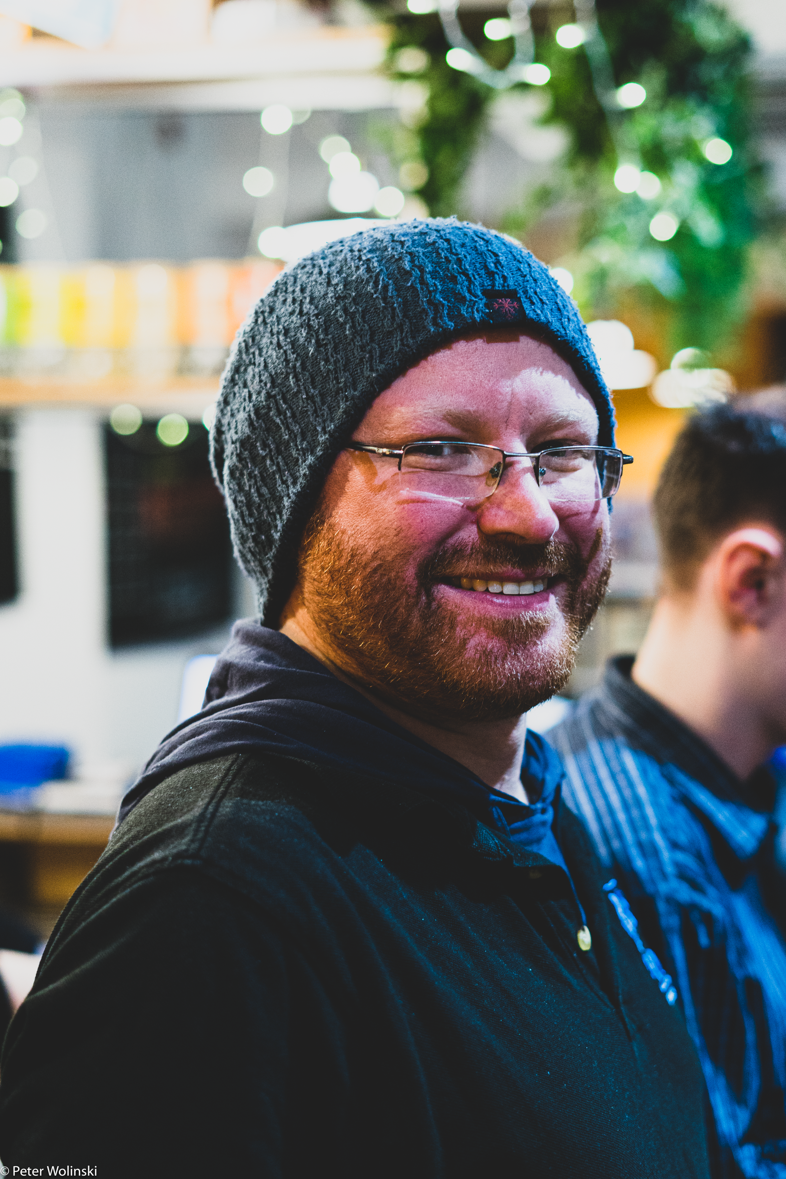 A portrait of Tom Burmeister, a board gaming events manager