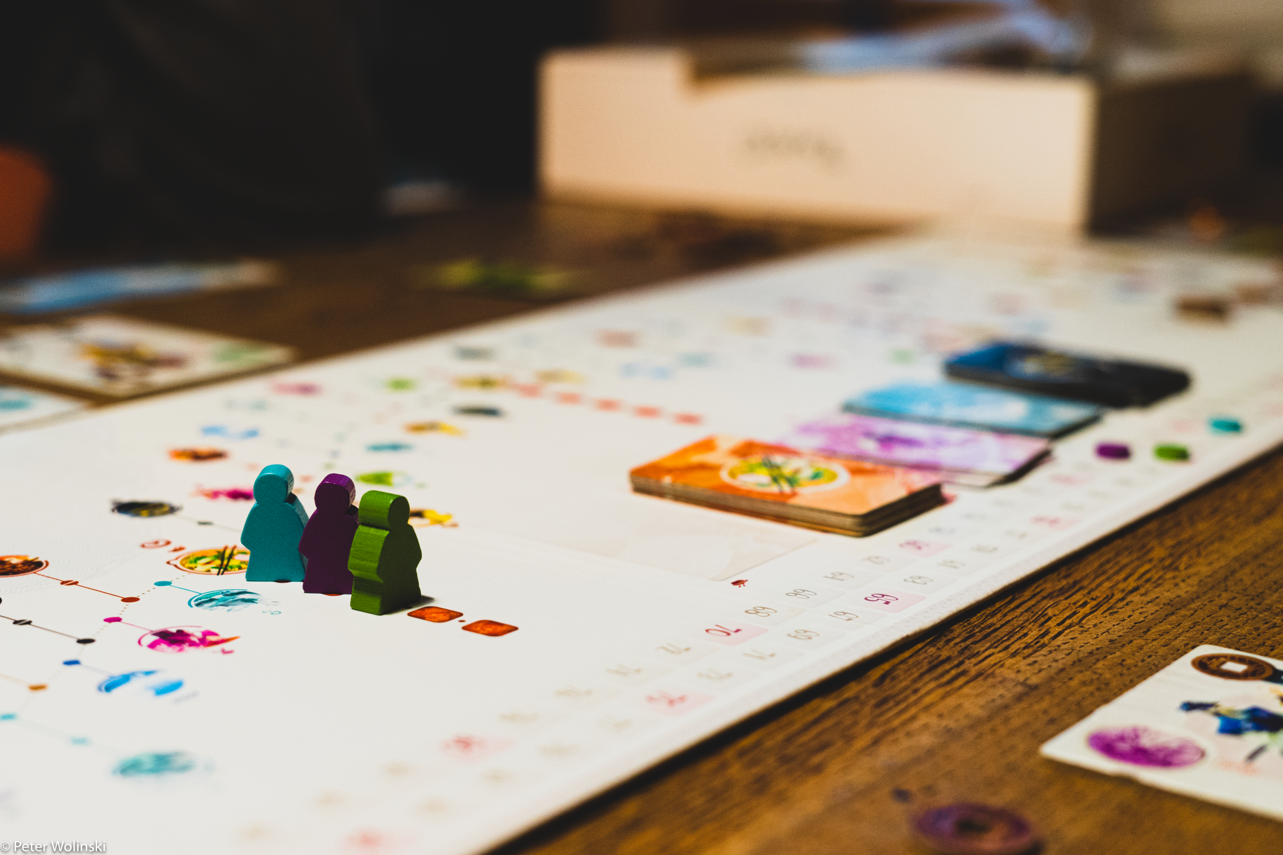A Tokaido board featuring three players. In this game, players race across feudal Japan