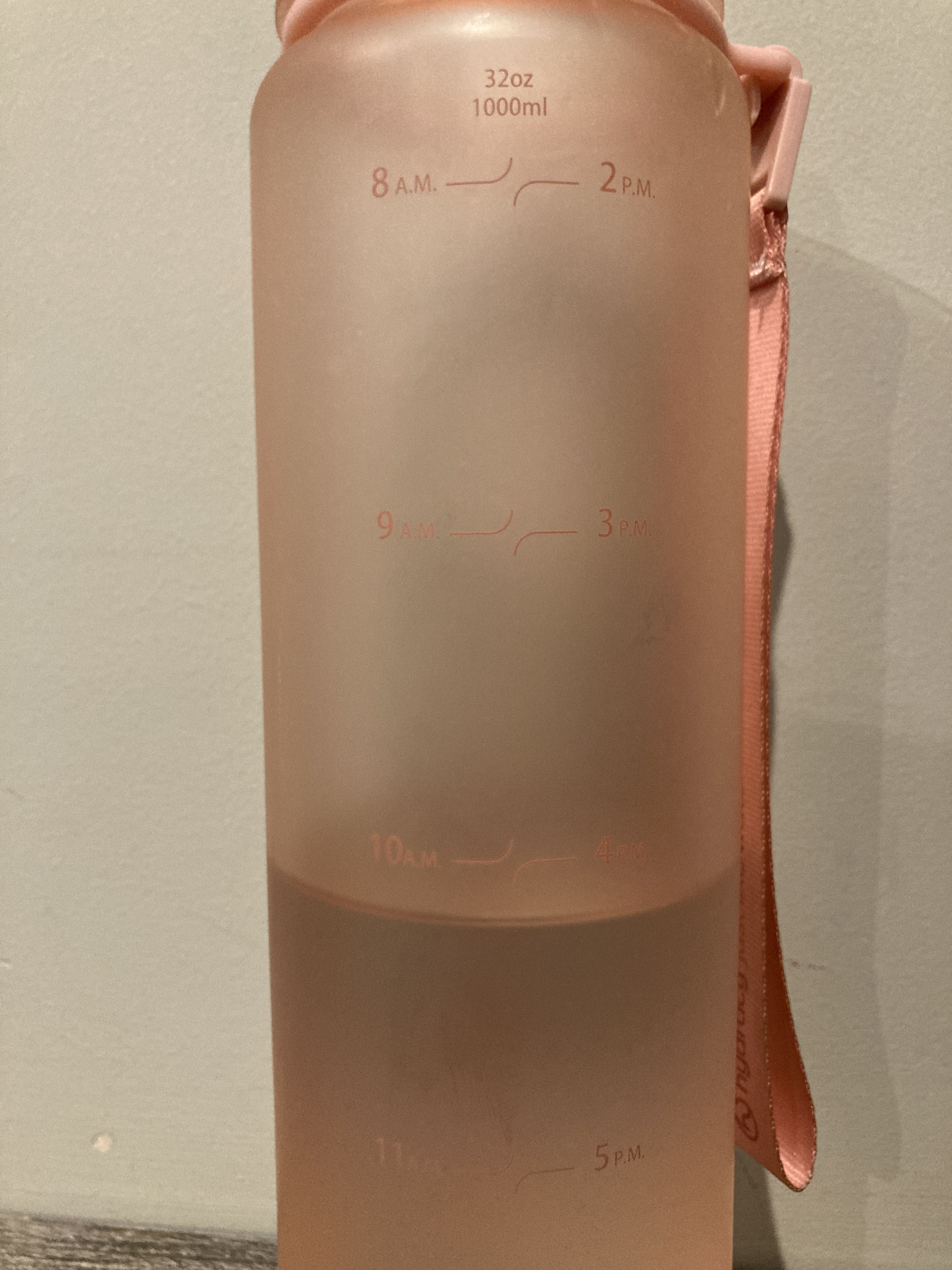 A water bottle filled to the '10am' marker
